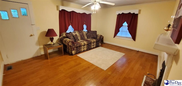 107 Patterson St, Bennettsville, SC 29512 - living area featuring wood finished floors and ceiling fan