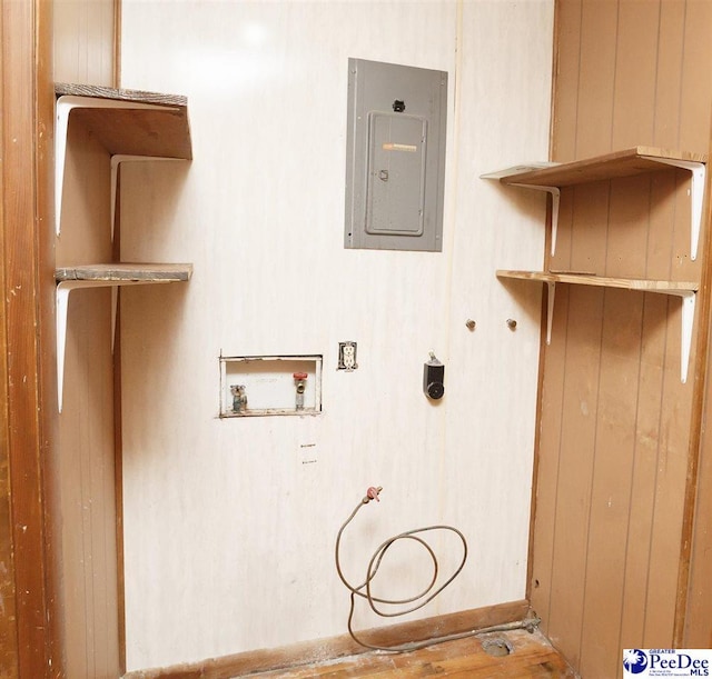 washroom with hookup for a washing machine and electric panel