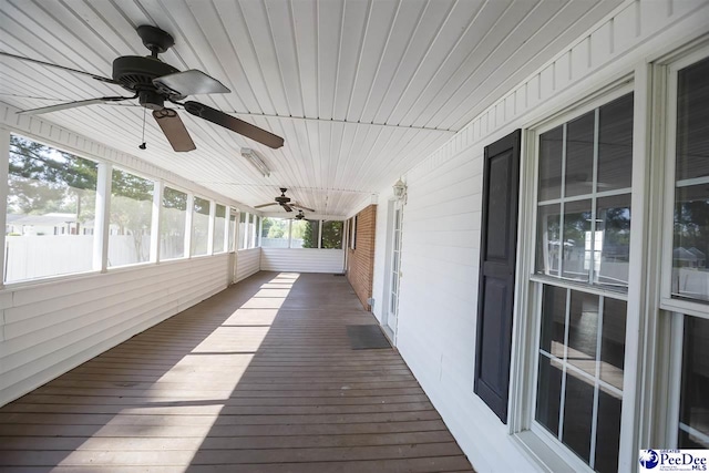 unfurnished sunroom featuring wood ceiling