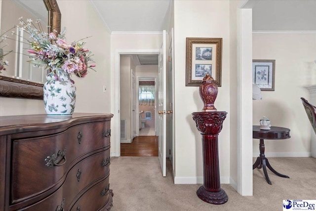 2338 W Mccown Dr, Florence, SC 29501 - hallway featuring light colored carpet, crown molding, and baseboards