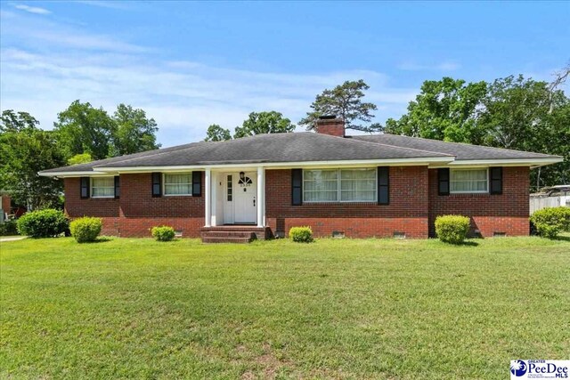 2338 W Mccown Dr, Florence, SC 29501 - ranch-style house with brick siding, a front lawn, a chimney, and crawl space