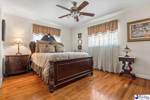 2338 W Mccown Dr, Florence, SC 29501 - bedroom with ornamental molding, light wood-style flooring, and ceiling fan