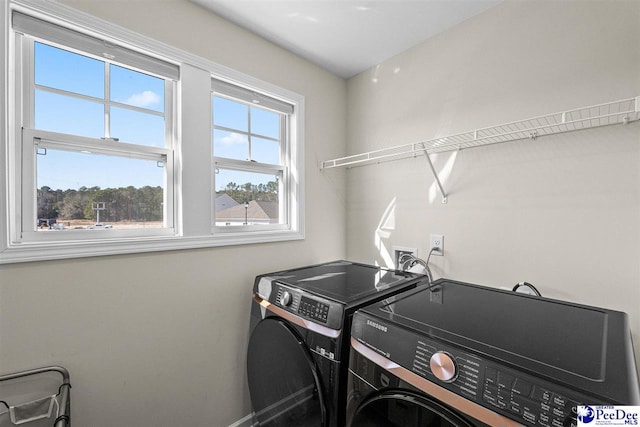 laundry room with laundry area and separate washer and dryer