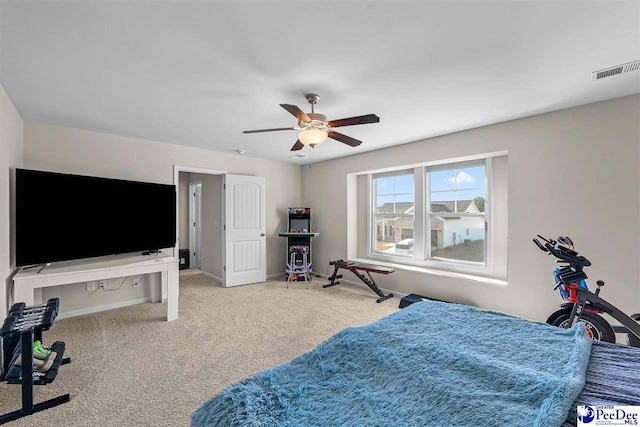 carpeted bedroom with ceiling fan, visible vents, and baseboards