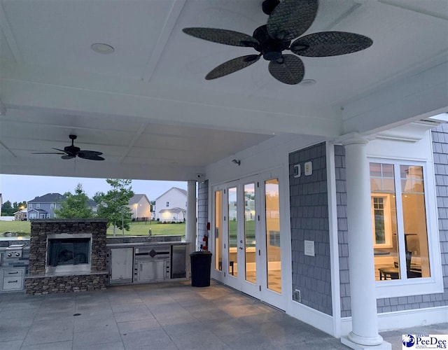 view of patio / terrace featuring french doors, a ceiling fan, and area for grilling