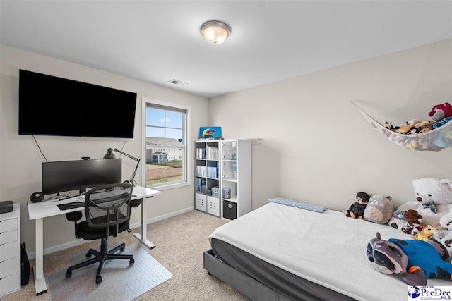 carpeted bedroom with baseboards and visible vents