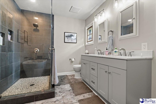 3844 W Lake Dr, Florence, SC 29501 - bathroom with a tile shower, double vanity, and stone finish floors