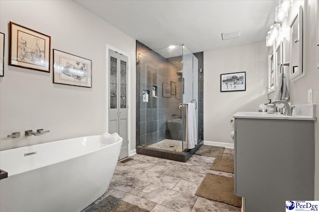 3844 W Lake Dr, Florence, SC 29501 - bathroom with vanity, a shower stall, a soaking tub, and french doors