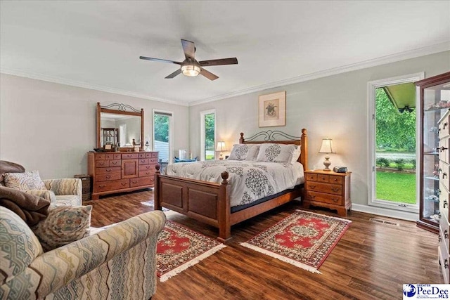 3844 W Lake Dr, Florence, SC 29501 - bedroom with dark wood finished floors, crown molding, and ceiling fan
