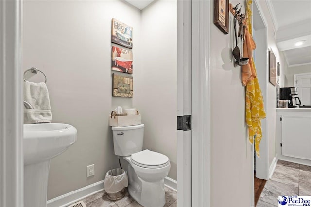 3844 W Lake Dr, Florence, SC 29501 - bathroom with toilet and ornamental molding