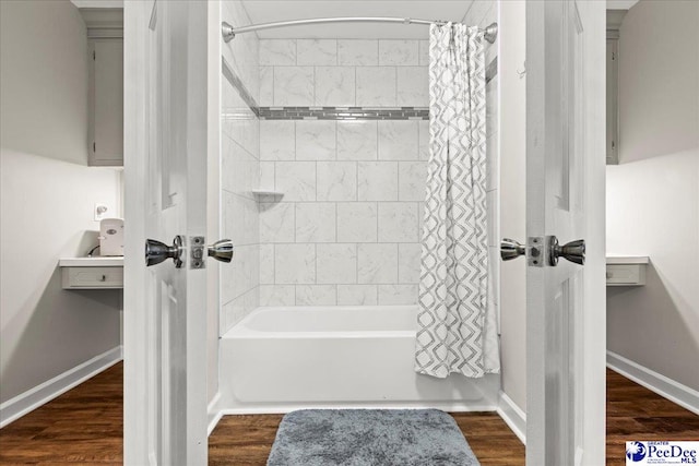3844 W Lake Dr, Florence, SC 29501 - bathroom featuring shower / bathtub combination with curtain and wood finished floors
