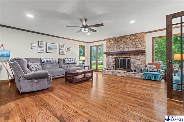 3844 W Lake Dr, Florence, SC 29501 - living room with crown molding, wood finished floors, healthy amount of natural light, ceiling fan, and french doors