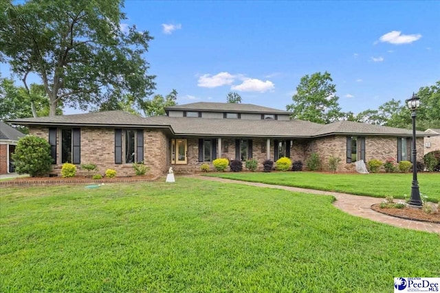 3844 W Lake Dr, Florence, SC 29501 - view of front of property featuring brick siding and a front yard