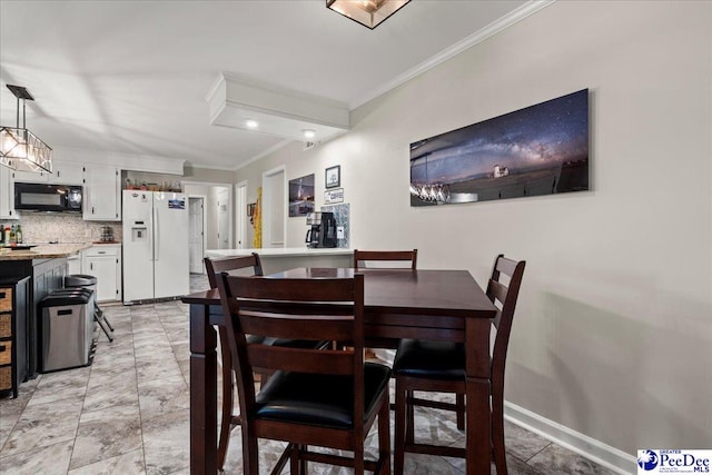 3844 W Lake Dr, Florence, SC 29501 - dining area with ornamental molding and baseboards