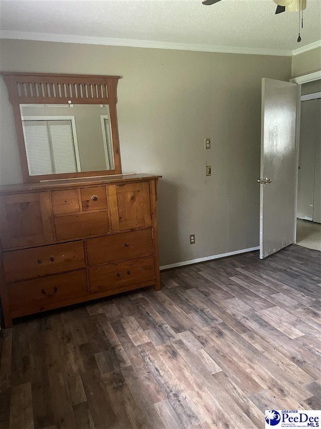 108 Swails St, Kingstree, SC 29556 - unfurnished bedroom featuring wood finished floors, ornamental molding, baseboards, and ceiling fan
