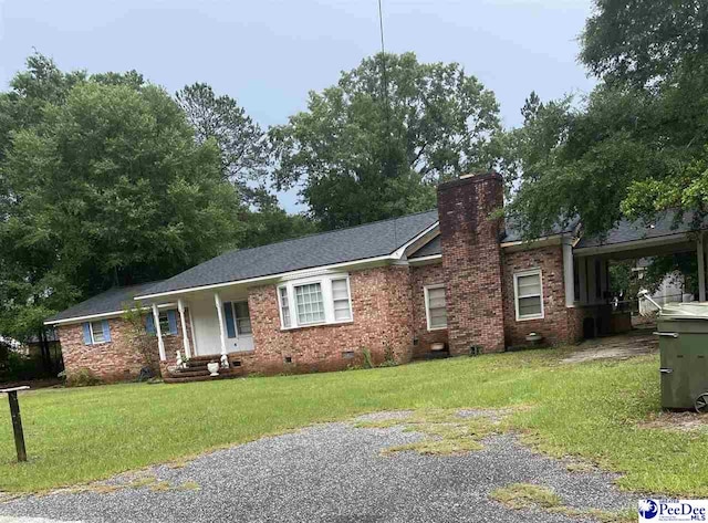 108 Swails St, Kingstree, SC 29556 - ranch-style house with crawl space, a chimney, and a front yard