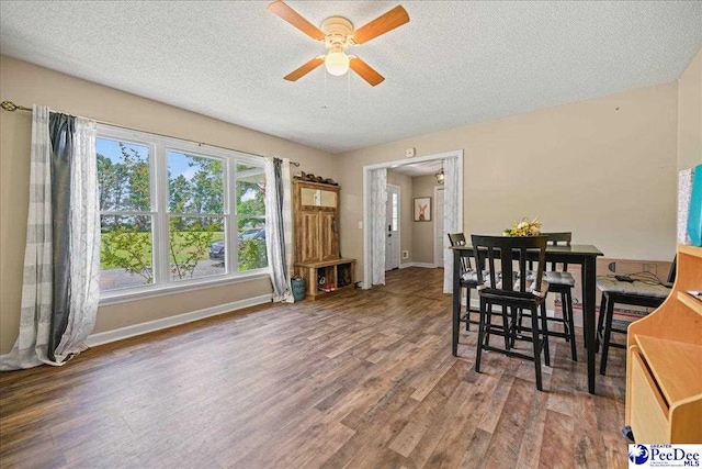 133 Peacock Row, Lamar, SC 29069 - dining area featuring a textured ceiling, ceiling fan, wood finished floors, and baseboards