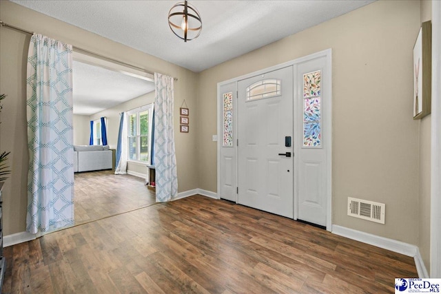 133 Peacock Row, Lamar, SC 29069 - entryway with baseboards and wood finished floors