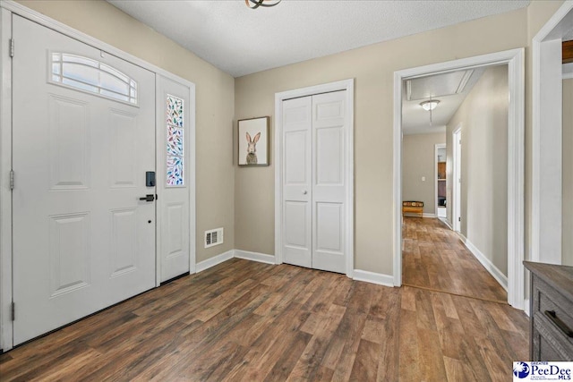 133 Peacock Row, Lamar, SC 29069 - entrance foyer featuring dark wood-type flooring and baseboards