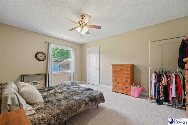 133 Peacock Row, Lamar, SC 29069 - bedroom with carpet flooring, a textured ceiling, ceiling fan, and baseboards