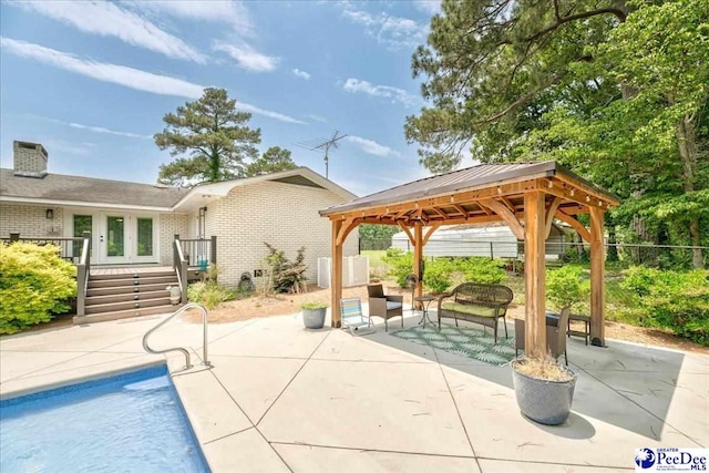 133 Peacock Row, Lamar, SC 29069 - outdoor pool with a gazebo, a patio area, a deck, and an outdoor living space