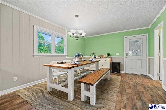 133 Peacock Row, Lamar, SC 29069 - dining room with wood finished floors, ornamental molding, a chandelier, a textured ceiling, and baseboards