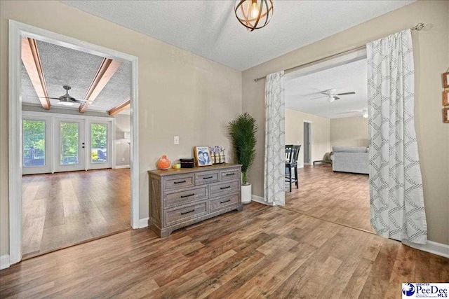 133 Peacock Row, Lamar, SC 29069 - corridor featuring wood finished floors, a textured ceiling, and baseboards