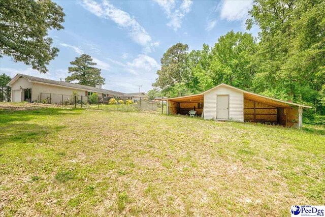 133 Peacock Row, Lamar, SC 29069 - view of yard featuring an outbuilding
