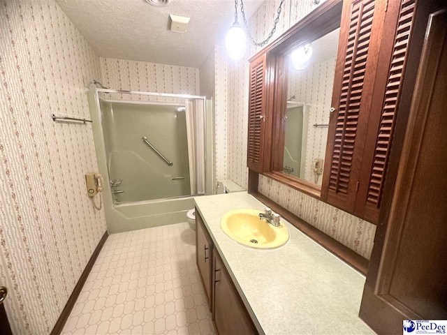 133 Bobwhite Rd, Cheraw, SC 29520 - bathroom featuring wallpapered walls, a textured ceiling, enclosed tub / shower combo, tile patterned floors, and vanity