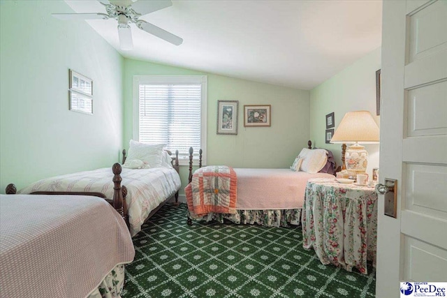 carpeted bedroom featuring vaulted ceiling and ceiling fan