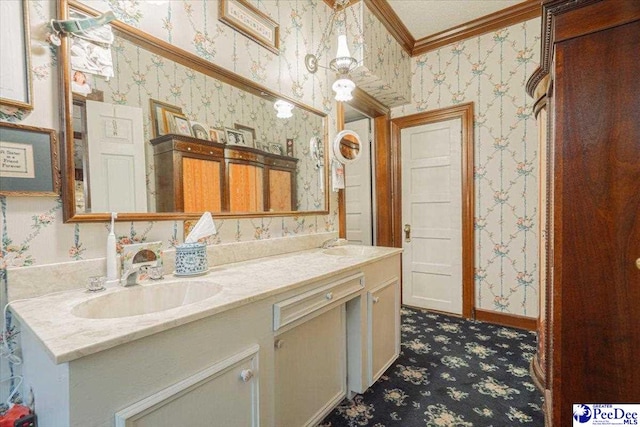 bathroom with vanity and crown molding