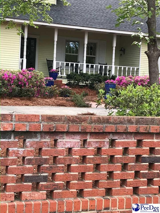 exterior space featuring covered porch