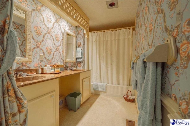 bathroom with vanity and shower / bath combo