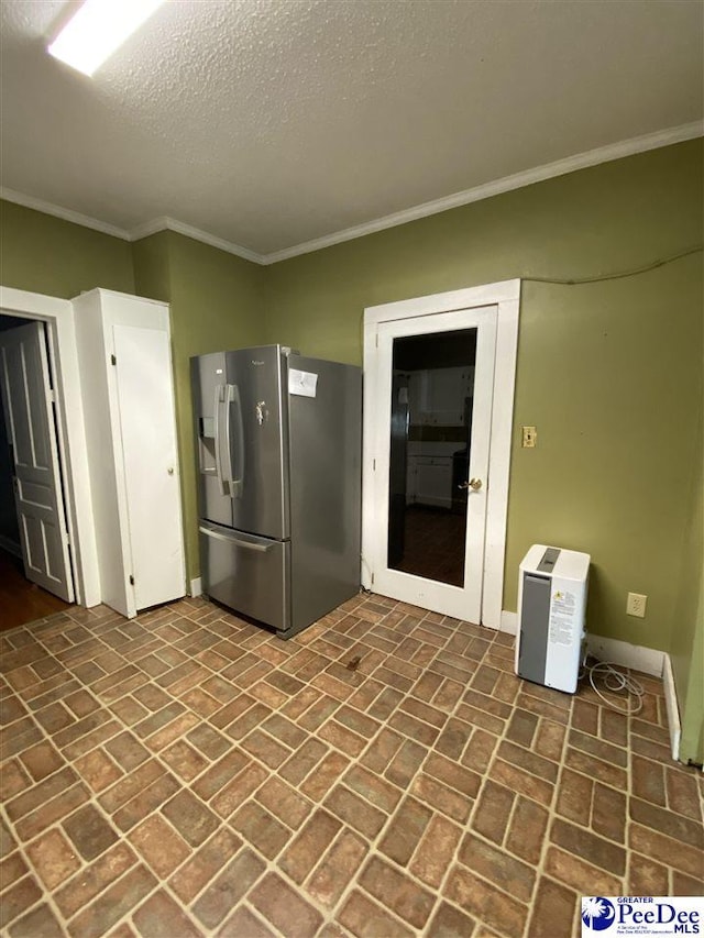 202 S Warley St, Darlington, SC 29532 - kitchen featuring stainless steel refrigerator with ice dispenser, brick patterned floors, crown molding, a textured ceiling, and baseboards