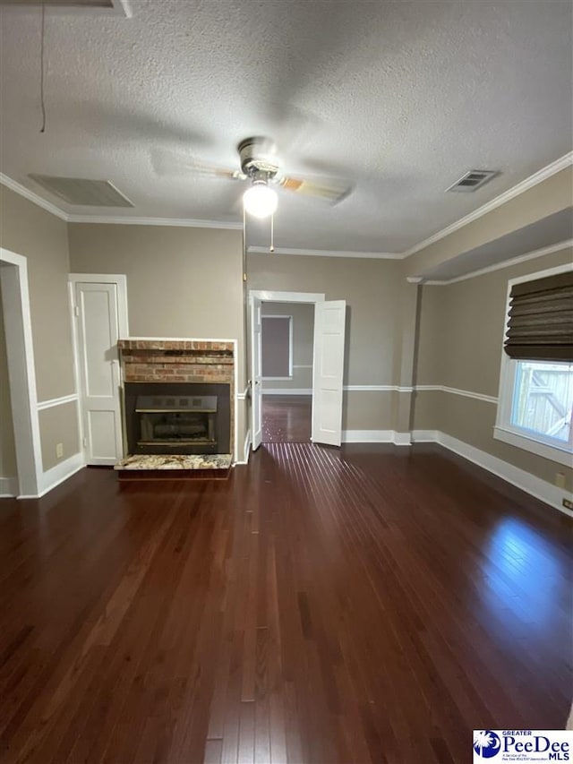 202 S Warley St, Darlington, SC 29532 - unfurnished living room with wood finished floors, baseboards, ceiling fan, a textured ceiling, and a glass covered fireplace