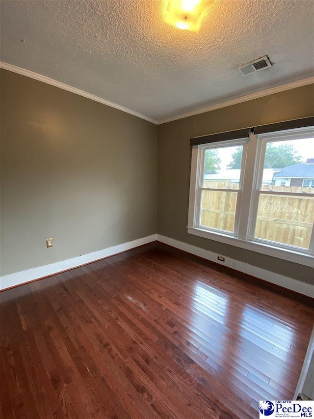 202 S Warley St, Darlington, SC 29532 - unfurnished room with dark wood-type flooring, a textured ceiling, baseboards, and crown molding