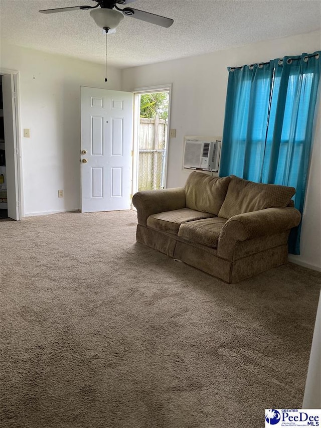 202 S Warley St, Darlington, SC 29532 - living area with a ceiling fan, a textured ceiling, carpet floors, and a wall unit AC