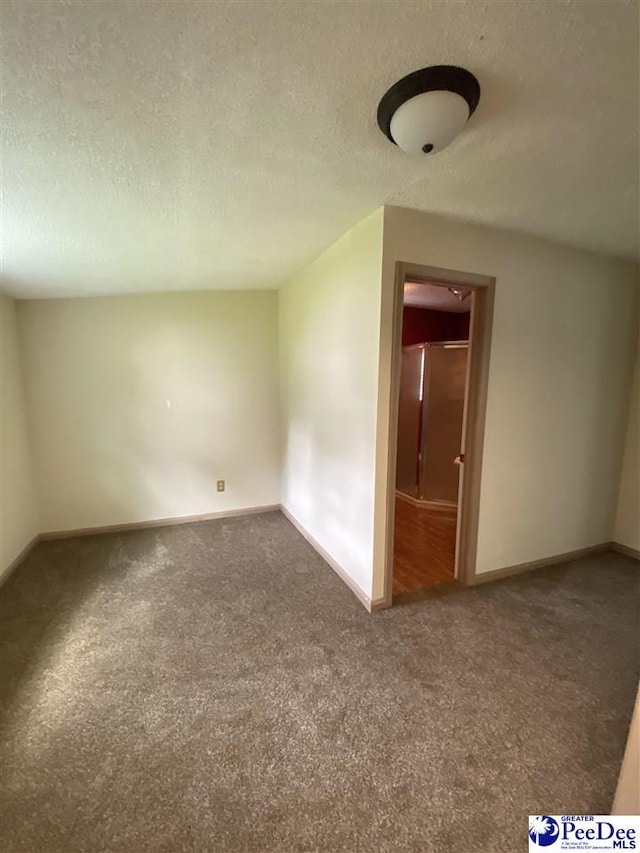202 S Warley St, Darlington, SC 29532 - carpeted empty room featuring a textured ceiling and baseboards