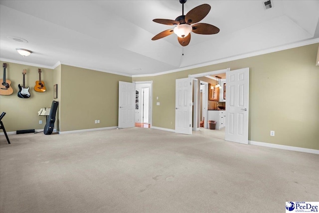 3402 Sussex Ct, Florence, SC 29501 - unfurnished living room featuring ceiling fan, crown molding, light carpet, and a tray ceiling