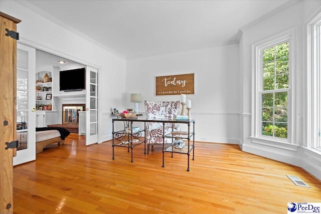 3402 Sussex Ct, Florence, SC 29501 - dining area with crown molding, light wood finished floors, and built in features