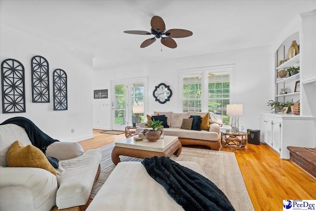 3402 Sussex Ct, Florence, SC 29501 - living area with ceiling fan, light wood finished floors, and ornamental molding