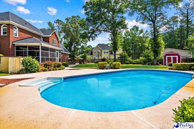 3402 Sussex Ct, Florence, SC 29501 - swimming pool featuring a sunroom and a storage shed