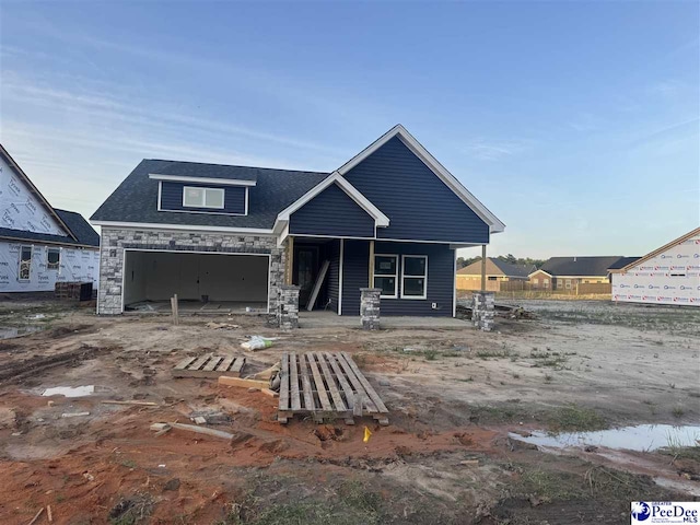 1035 Wessex Dr, Florence, SC 29501 - craftsman house featuring covered porch, brick siding, driveway, a garage, and a front yard