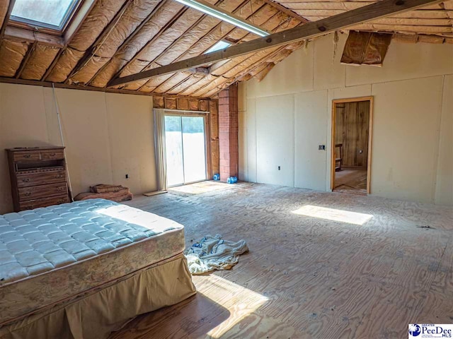 2305 Sandra Cir, Palmplico, SC 29583 - unfurnished bedroom with a skylight, access to outside, beamed ceiling, and high vaulted ceiling