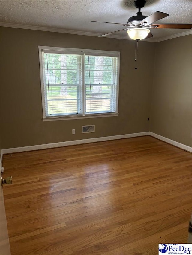 111 Brittain Rd, Darlington, SC 29532 - empty room with ceiling fan, wood finished floors, a textured ceiling, crown molding, and baseboards