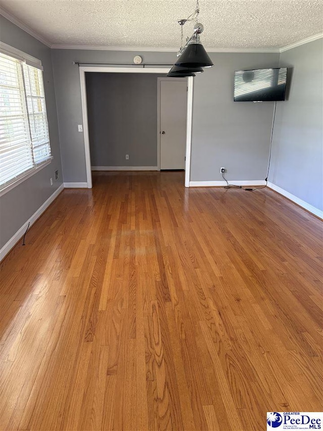 111 Brittain Rd, Darlington, SC 29532 - spare room featuring ornamental molding, a textured ceiling, light wood finished floors, and baseboards