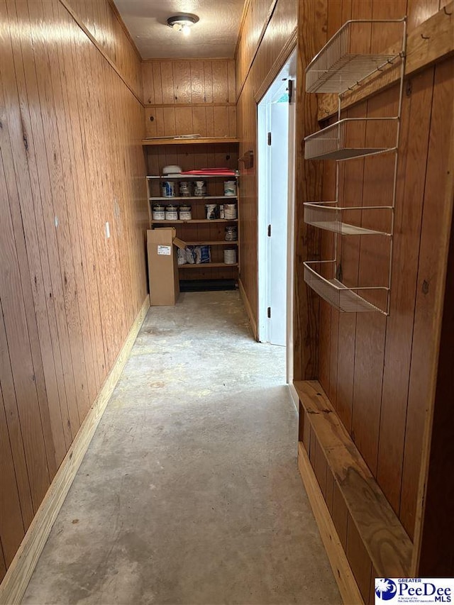 111 Brittain Rd, Darlington, SC 29532 - corridor featuring wooden walls and unfinished concrete floors