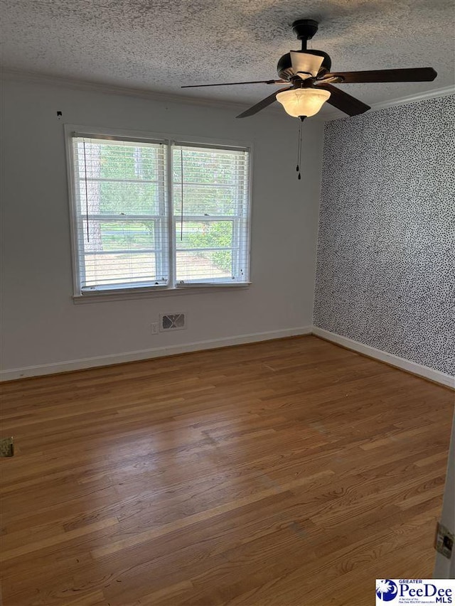 111 Brittain Rd, Darlington, SC 29532 - unfurnished room with a ceiling fan, wood finished floors, a textured ceiling, and baseboards