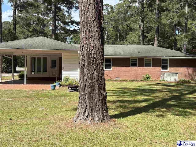 111 Brittain Rd, Darlington, SC 29532 - view of front facade with a front yard, brick siding, crawl space, and a shingled roof