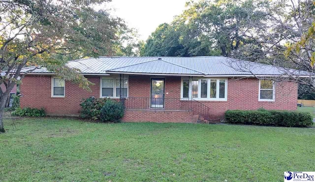 ranch-style house with a front yard